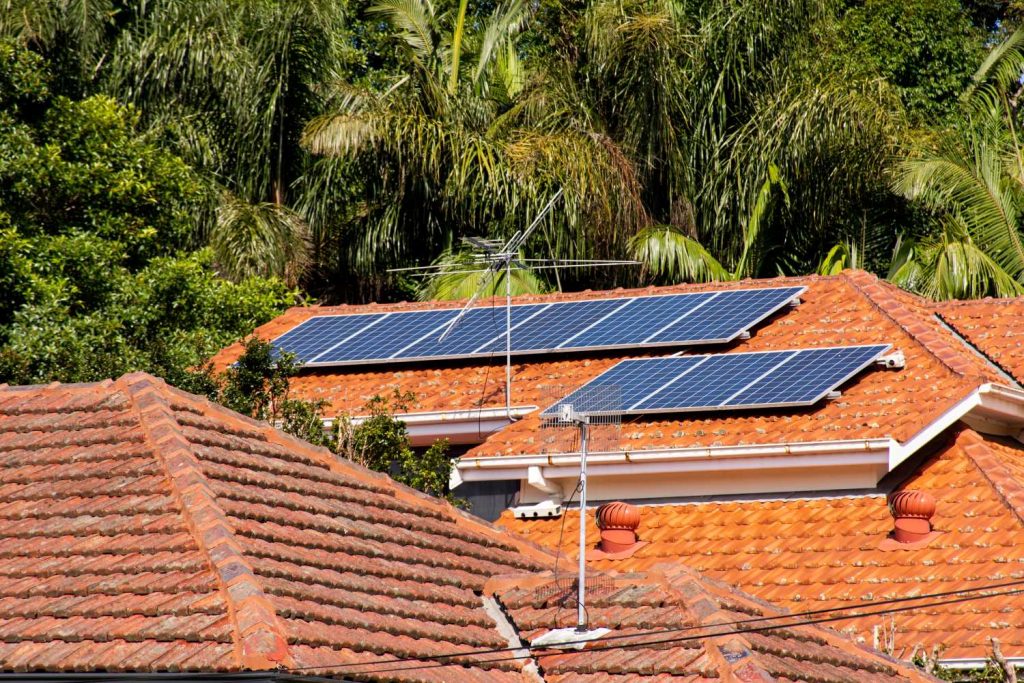 Solar panels on a tiled roof | Featured image for the Solar Battery rebate QLD blog article from Latched Electrical Solutions.